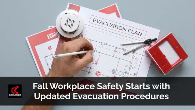 Person reviewing an evacuation plan with safety tools, highlighting fall workplace safety and updated evacuation procedures.